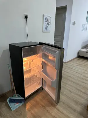 an empty refrigerator with its door open in a room at Ayaan Snookers Home 3 at Quintet Apartment with Private Parking in Tanah Rata