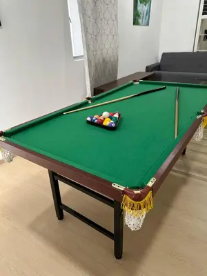 a green pool table with balls on top of it at Ayaan Snookers Home 3 at Quintet Apartment with Private Parking in Tanah Rata