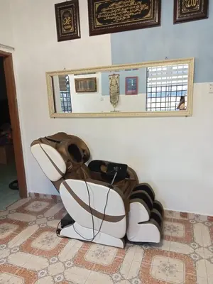 a toilet in the corner of a room at Homestay Mariah in Ipoh