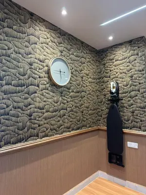 a clock on the wall of a waiting room at Adik Aisyah black forest luxury cameron homestay in Tanah Rata