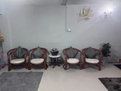 a group of chairs and a table in a room at Homestay Pangkor Ann in Pangkor