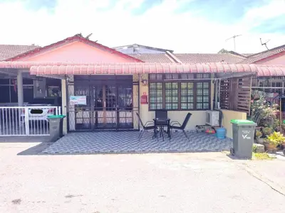 a house with a porch with a table and chairs at Sacha Semarak in Baling