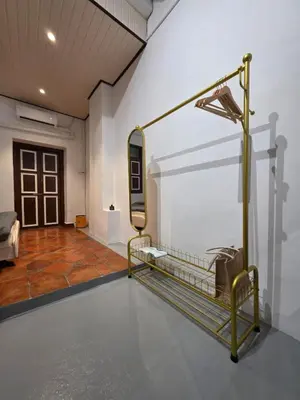 a room with a bed and a mirror on the wall at Popular! 4 pax Georgetown Heritage Pre-war House 2 Bedroom in George Town