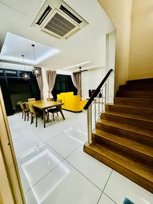 a living room with stairs and a table and chairs at Batu Ferringhi PoolBBQ 5minBeach Night Market20pax in Batu Ferringhi
