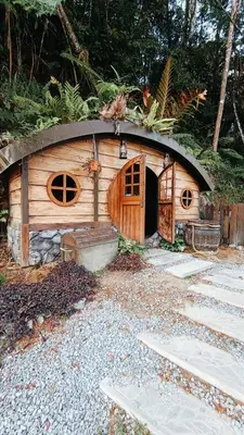 a small wooden dog house with a round roof at B661 SilverparkResort -walk up in Bukit Fraser