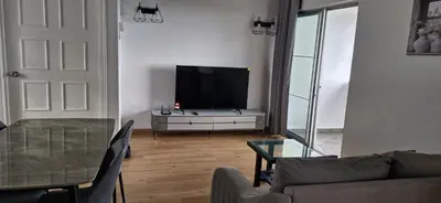 a living room with a flat screen tv on a dresser at B661 SilverparkResort -walk up in Bukit Fraser