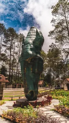 a statue of a cat in a park at B661 SilverparkResort -walk up in Bukit Fraser