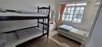 a room with two bunk beds and a window at A23A5 Silverpark HighFloorView in Bukit Fraser