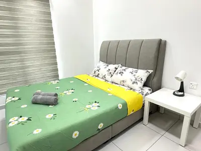 a bedroom with a bed with flowers on it at NEW Batu Kawan 2 Bedrooms Suite near IKEA-Columbia Asia Hospital-BKIP-UOW Kdu in Simpang Ampat
