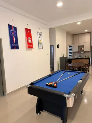 a pool table in a living room with at Ayaan FIFA Hub Quintet House - Ultimate Gaming Stay in Tanah Rata