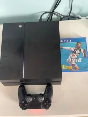 a black computer monitor with a video game controller at Ayaan FIFA Hub Quintet House - Ultimate Gaming Stay in Tanah Rata