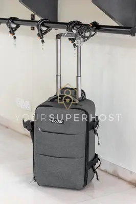 a luggage bag is hanging from a pole at 8 Concordia by YourSuperHost in George Town