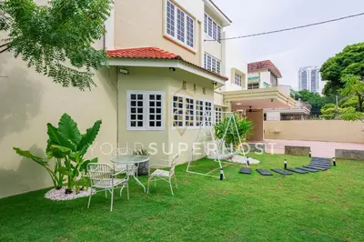 a house with a lawn in front of it at 8 Concordia by YourSuperHost in George Town