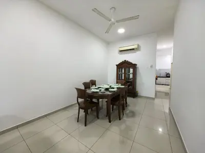 a dining room with a table and chairs at Bertam Holiday Homestay 01 in Kepala Batas