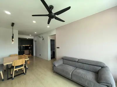 a living room with a couch and a ceiling fan at Meritus Relax Holiday Homestay in Perai