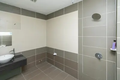 a bathroom with a sink and a shower at Tanjung Bungah Villa 20 pax Mahjong Snooker and More Close to Beach in Tanjung Bungah