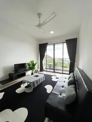 a living room with a couch and a large window at Palas Horizon By Lume' Living Homestay near Kea Farm Market, 2Bedroom, Sunrise View in Brinchang