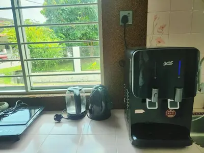 a toaster sitting on a counter next to a backpack at Ipoh Tambun pool villa 5br20pax bbq karaoke mahjong in Ipoh