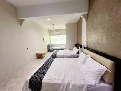 a hotel room with two beds in a room at Ipoh Tambun pool villa 5br20pax bbq karaoke mahjong in Ipoh