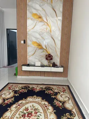a room with a wall with a flower mural at Homestay Cikgu Ina in Kampong Chepor