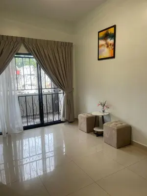 a living room with a large window and a table at Ipoh Calm Corner in Ipoh