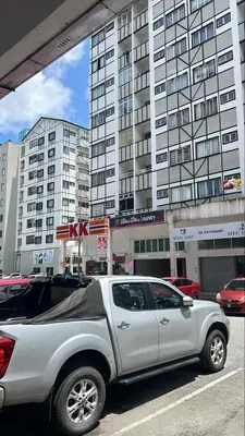 a white truck parked in front of a building at Cool Escape Apartment Cameron Highlands in Cameron Highlands