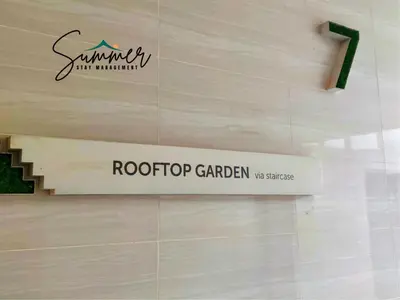 a sign for a roof top garden on a wall at CAMERON HIGHLAND Homestay 1 min To Pasar Malam Brinchang By SummerStay 4 - 5pax in Brinchang