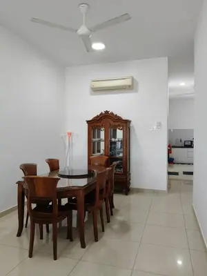 a dining room with a table and chairs at Bertam Perdana Homestay