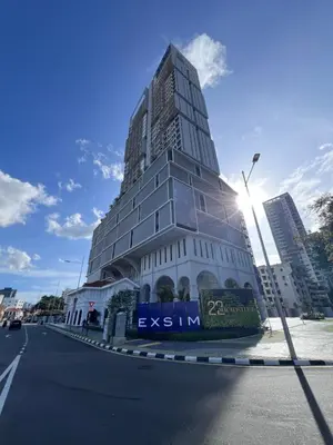 a tall building in the middle of a street at NEW Georgetown 22 Macalisterz Elegant 2BR 5pax in George Town