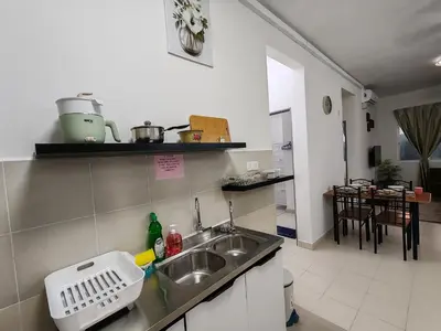a kitchen with a sink and a counter top at Aplan Falim by Irainbow in Ipoh