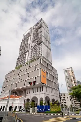 a tall building on the corner of a street at 22 Macalisterz George Town By KLIQ in George Town