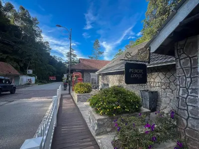 a sign on the side of a building on a street at A357 Silverpark Resort Best Mountain view in Bukit Fraser