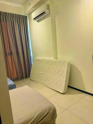 a room with a bed and an air conditioner at Stylish 3BR Retreat w Stunning Sea Views Fits 10 A29 in George Town