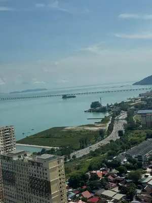 a view of a city with a bridge in the water at Modern 3BR w Panoramic Ocean Views Sleeps 10 A29 in George Town