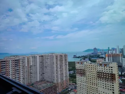 a view of a city with tall buildings and the ocean at Luxe 3BR Seaview Escape Sleeps 10 Prime Location A29 in George Town