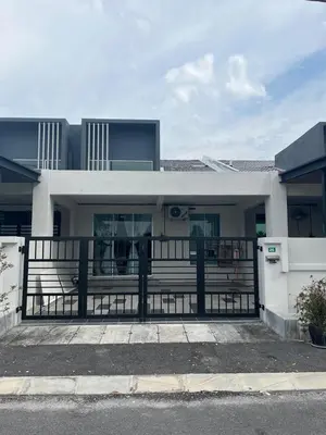 a building with a black fence in front of it at Homestay AtinAya in Tanjung Rambutan