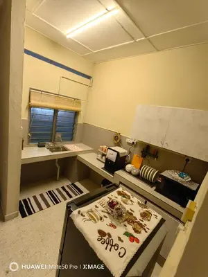 a kitchen with a sink and a stove top oven at TL Legend Homestay2 - 4 bedroom single story house in Ipoh