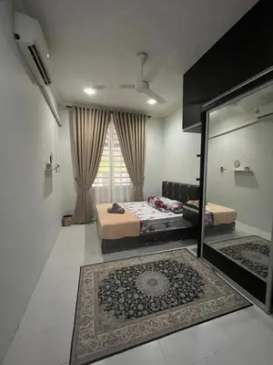 a bedroom with two beds and a large window at Family friendly flower homestay-3bedroom in Gerik