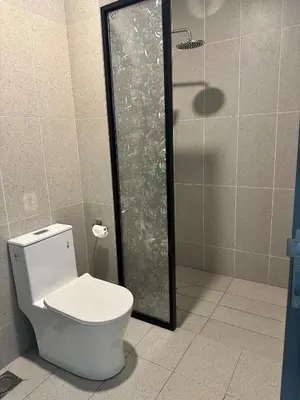 a bathroom with a toilet and a shower at Cozy studio with Komtar view at 22 Macalisterz in George Town