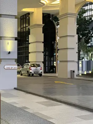 a car parked in front of a building at Cozy studio with Komtar view at 22 Macalisterz in George Town
