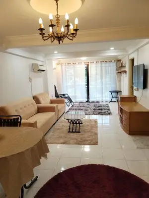 a living room with a couch and a table at Ed 03 lumut Waterfront in Lumut