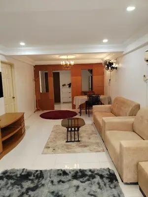 a living room with a couch and a table at Ed 03 lumut Waterfront in Lumut