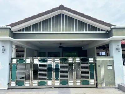 a house with a gate in front of it at MiuMiu Homestay in Teluk Intan