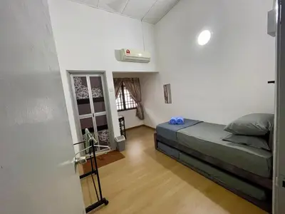 a bedroom with a bed in a room at Inap by KF in Bayan Lepas