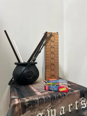 a table with a ruler and chopsticks and a box at Harry Potter Homestay Cameron Highlands in Tanah Rata