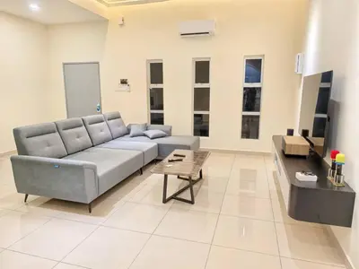 a large living room with a couch and a table at Hello Pangkor Home 73A - A Nest for 12 buddies in Pangkor