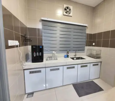 a white kitchen with a sink and a window at Hello Pangkor Home 73A - A Nest for 12 buddies in Pangkor