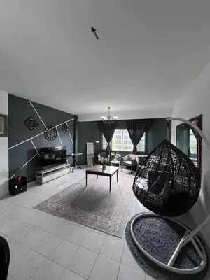a large living room with a couch and a swing at Dheaa's Homestay Cameron Highlands in Tanah Rata