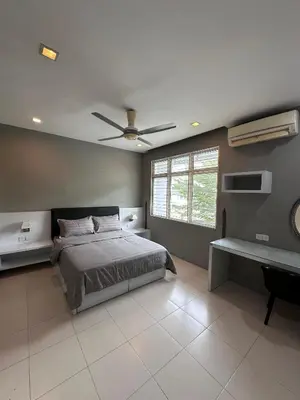a bedroom with a bed and a ceiling fan at Shamrock By Island Hospitality in Batu Ferringhi