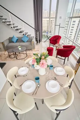 a dining room with a table and chairs at Maritime Suite with Seaview 2BR - Water Dispenser - Dryer in George Town